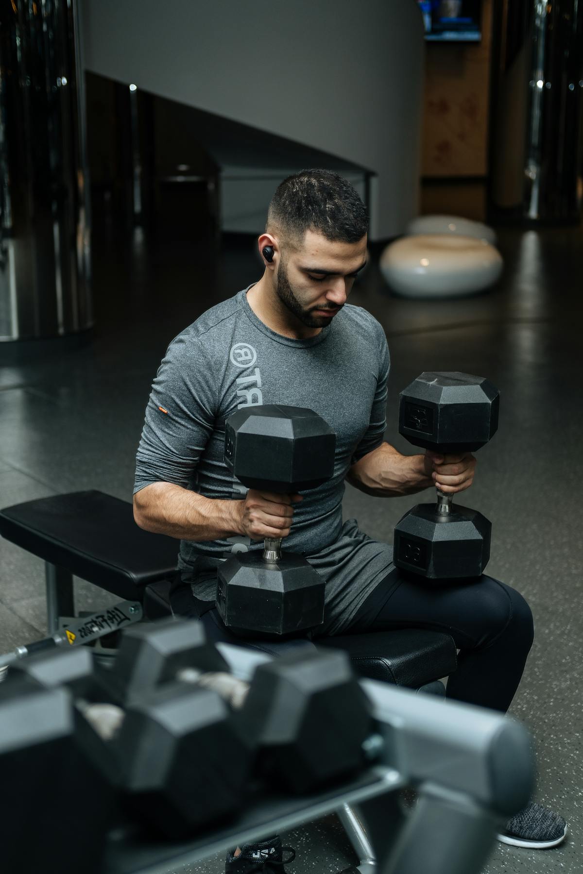 Athlete resting between sets in a gym